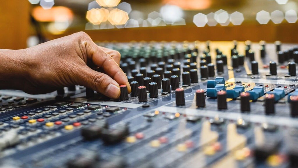 4. Close-up of keyboard and mixer during music track creation