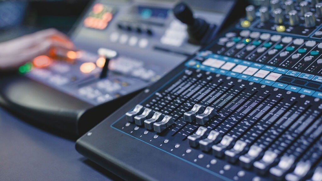 Artist and sound engineer engaged in music collaboration with studio support at Splaky Studio